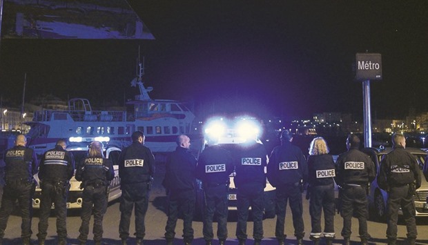 French police take part in a protest at the old harbour in Marseille on Tuesday night.