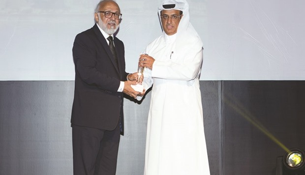 Al-Kubaisi (right) receiving the u2018Hospitality Company of the Yearu2019 award on behalf of Katara Hospitality.