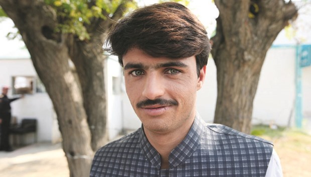 Arshad Khan, formerly a u2018chai walau2019 (tea seller) by profession, poses for a picture after doing a television interview in Islamabad.