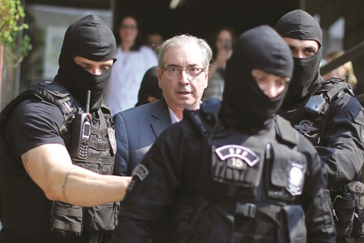 Brazilu2019s former president of the chamber of deputies, Eduardo Cunha, arrives at the Forensic Medicine Institute in Curitiba yesterday.