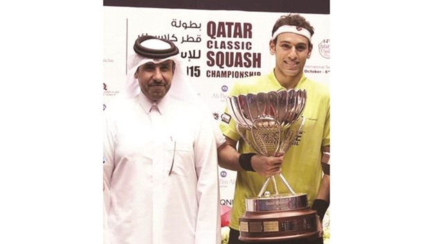 Defending champion Mohamed Elshorbagy (right) poses with Qatar Olympic Committee secretary general Dr Thani al-Kuwari after winning the 2015 Qatar Classic Squash Championship.