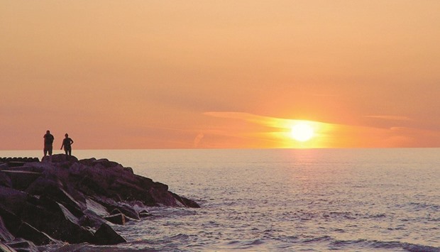 PICTURESQUE: The sun sets over Lake Michigan.