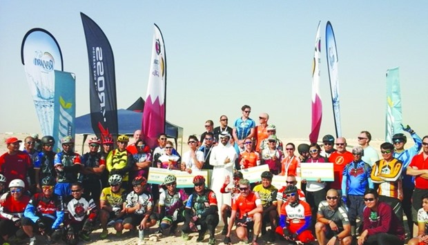 Winners of QCR's MTB Championship join other participants and Farhan-al-Sayed in celebrating their victory