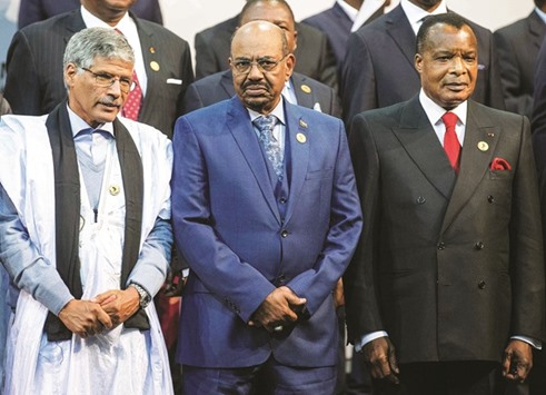 This file photo taken on June 14, 2015 shows Sudanese President Omar al-Bashir (centre) with Congo Republic President Denis Sasso-Nguesso (right) and Prime Minister of the Sahrawi Arab Democratic Republic Abdelkader Taleb Oumar during a photo call at the 25th African Union Summit in Sandton, South Africa.