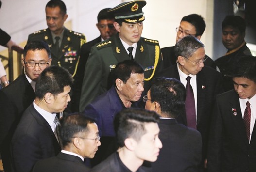 President Rodrigo Duterte leaves a hotel in Beijing yesterday.