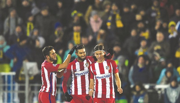 Yannick Carrasco (centre) has been in fine form for Atletico Madrid. (AFP)