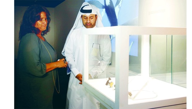 Portuguese artist Mary briefs Katara general manager Dr Khalid bin Ibrahim al-Sulaiti on some of her jewellery collections.