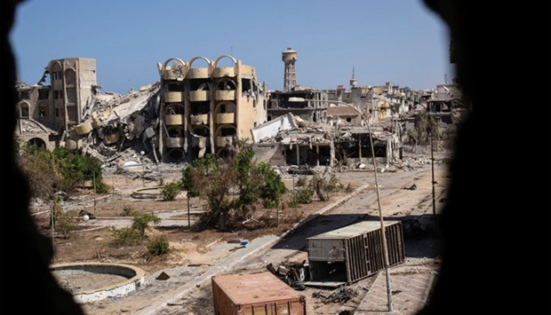 A general view shows destroyed buildings in the District 3 neighbourhood of Sirte