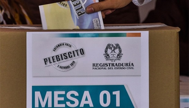 A Colombian citizen casts his vote during a referendum