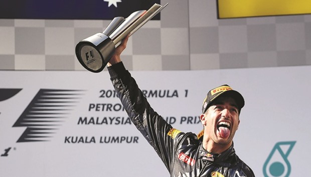 Red Bull driver Daniel Ricciardo celebrates his victory in Malaysian Grand Prix on the podium in Sepang yesterday. (AFP)