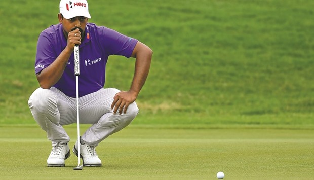 Anirban Lahiri of India lines up a putt during the third round of 2016 CIMB Classic golf tournament in Kuala Lumpur yesterday. (AFP)