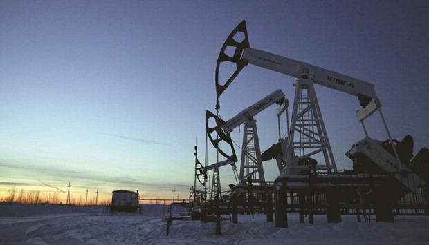 Pump jacks are seen at the Lukoil company owned Imilorskoye oil field, as the sun sets, outside the West Siberian city of Kogalym, Russia (file). Just days before Energy Minister Alexander Novak heads to Vienna for discussions that could include output curbs, Russian officials have emphasised the nationu2019s ability to keep increasing record output to even loftier heights.