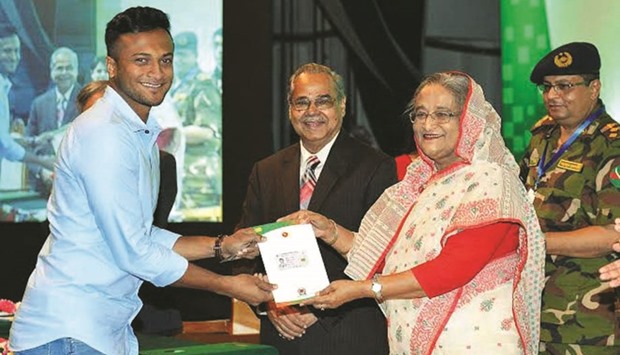 Prime Minister Sheikh Hasina handing over a smart national identity card to cricketer Shakib Al Hasan in Dhaka yesterday.
