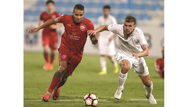Lekhwiyau2019s Youssef El Arabi (left) vies for the ball with Al Wakrahu2019s Mohamed Arafah during the QSL match yesterday. PICTURE: Anas Khalid
