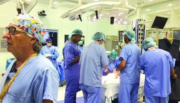 Dr Joao Luiz Pippi Salle (left) briefing the family during the recent surgery.