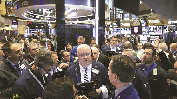 Traders work on the floor of the New York Stock Exchange. US companies are reporting annual profit growth for the first time in six quarters, but investors donu2019t seem too excited about it.