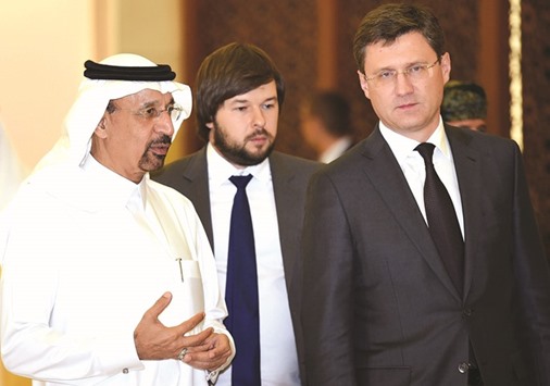 Al-Falih (left) walks alongside Novak (right) during their meeting in Riyadh yesterday. Novak met with counterparts from Saudi Arabia and other Gulf oil-producers to discuss steps to stabilise crude markets.