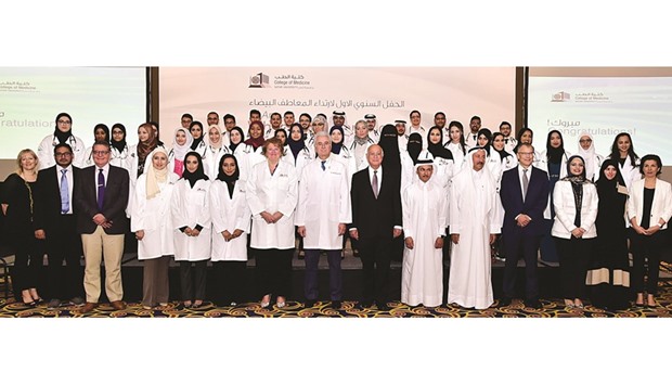 Students of QU-CMED with officials and dignitaries.