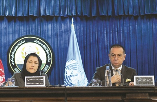Afghan Minister of Counter Narcotic, Salamat Azimi (left) and Head of UNODC, regional representative for Afghanistan, Andrey Avetisyan attend a press conference in Kabul yesterday.