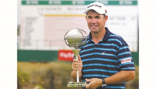 Irish golfer Padraig Harrington holds his trophy after winning the Portugal Master at Oceanico Victoria golf course in Vilamoura yesterday. (AFP)