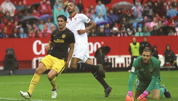 Sevillau2019s Steven Nu2019Zonzi (centre) reacts after scoring against Atletico Madrid during the Spanish La Liga at Sanchez Pizjuan stadium in Seville. (Reuters)