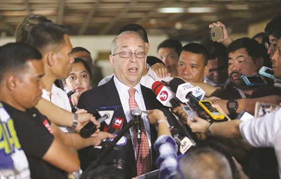 US Assistant Secretary of State Daniel Russel (centre) talks to members of the press after a meeting with Philippine Foreign Affairs Secretary Perfecto Yasay (not pictured) at the Department of Foreign Affairs office in Manila yesterday.