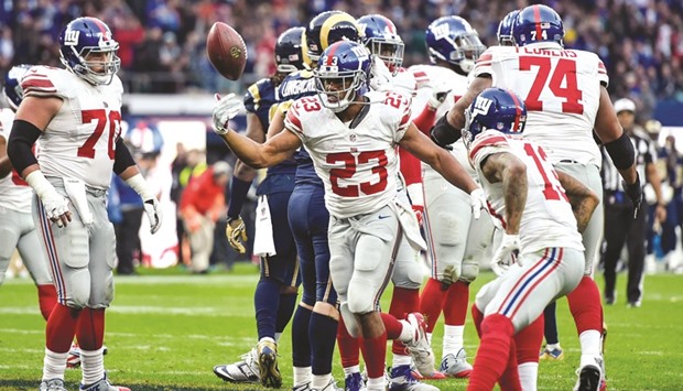 Running back Rashad Jennings (23) of the New York Giants celebrates his winning touchdown against Los Angeles Rams.