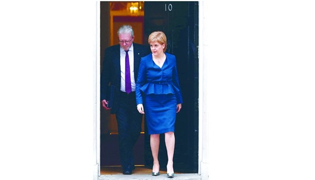 Scottish First Minister Nicola Sturgeon and Scottish Brexit minister Michael Russell leave 10 Downing Street in central London after holding talks with Prime Minister Theresa May and the first ministers of Wales and Northern Ireland on the governmentu2019s Brexit plans.