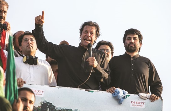 Imran Khan, the Chairman of the Pakistan Tehreek-e-Insaf (PTI) political party, addresses supporters during the Revolution March in Islamabad August 31, 2014.