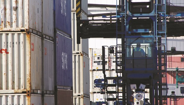 A driver sits in a container lift truck at an industrial port in Tokyo. Japanu2019s exports fell 6.9% in September from a year earlier, following a 9.6% decline in August, ministry of finance data showed yesterday.