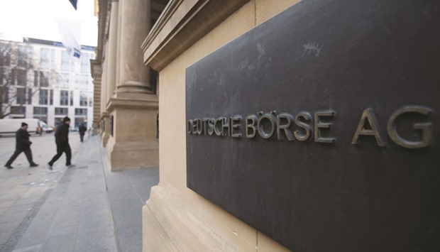 The plaque of the Deutsche Boerse is seen at the entrance of the Frankfurt Stock Exchange. The DAX 30 closed up 0.5% to 10,761.17 points yesterday.