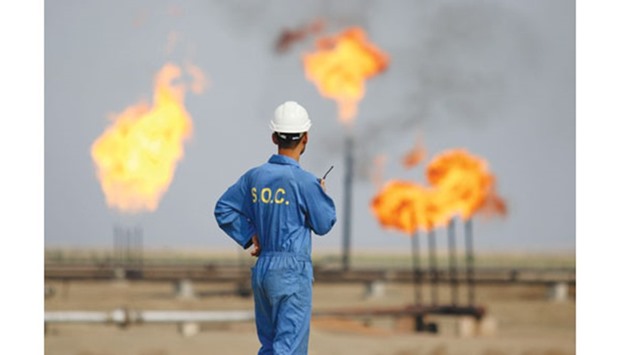 An Iraqi labourer works at an oil refinery in the southern town Nasiriyah. Iraq should be exempted from cutting production because itu2019s embroiled in a war with Islamic militants, Oil Minister Jabber al-Luaibi said on Sunday in Baghdad. The country currently produces more than 4.7mn bpd it pumped in September.