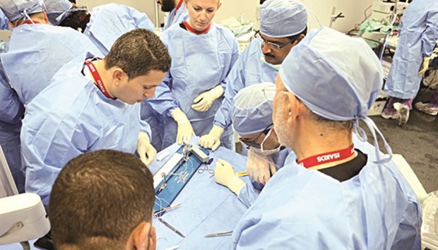 Master Class participants attend surgical demos.