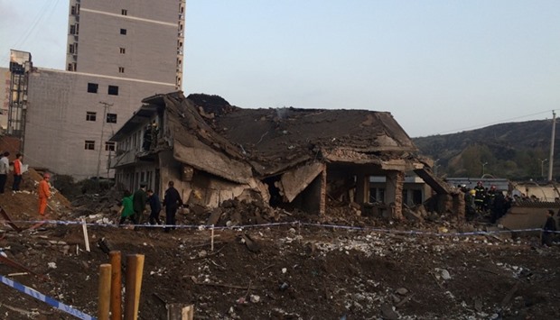 A collapsed house is seen at site after an explosion hit a town in Fugu county, Shaanxi province, China, October 24, 2016