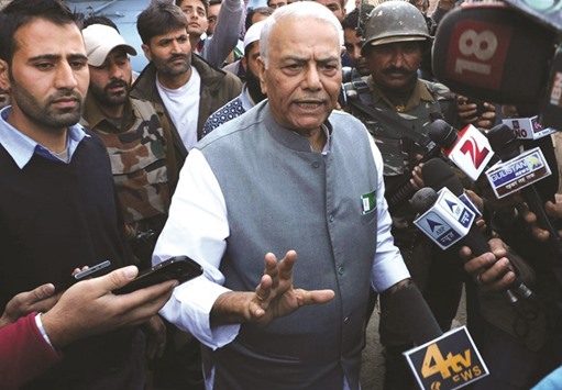 Sinha talks to reporters after meeting Geelani in Srinagar yesterday.