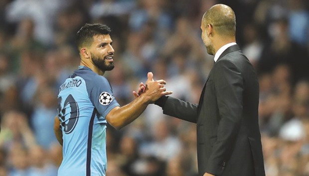 Sergio Aguero (left) with Pep Guardiola