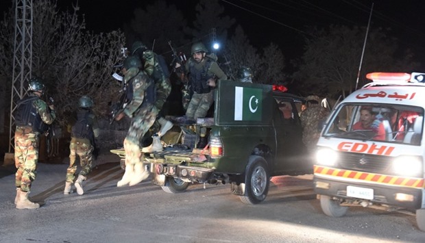 Pakistani army soldiers arrive at the Balochistan Police Training College in Quetta yesterday late night, after militants attacked the police academy.