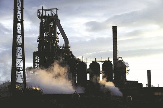 One of the blast furnaces of the Tata Steel plant is seen at sunset in Port Talbot, South Wales. The groupu2019s revenue slipped 4.6% for the financial year ended March to about $103bn. One of its worst performers is Tata Steel, which last month reported a quarterly net loss of almost Rs32bn ($475mn), as it winds back its European operations.
