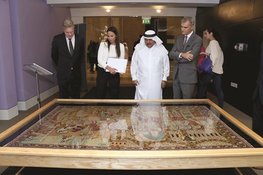 PIECING THE PAST: Spanish Ambassador Ignacio Escobar (first right), Sheikh Faisal bin Qassim al-Thani (centre) and other guests view the pieces on display.