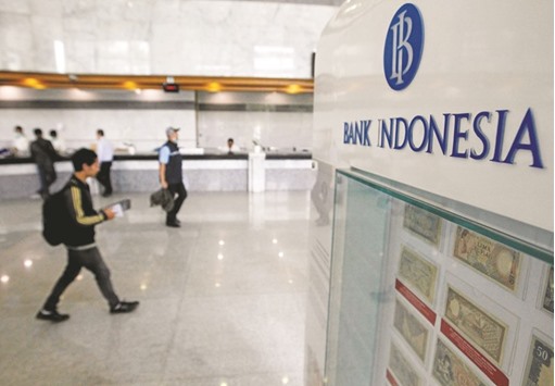 People walk past the teller counter inside the Bank Indonesia in Jakarta. The banking sector in Indonesia is still a fairly profitable system, itu2019s self-funded, itu2019s not reliant on external savings to fund its loan book growth and lending standards are adequate, Kyran Curry, a director of sovereign ratings and S&Pu2019s primary analyst for the country, said yesterday.
