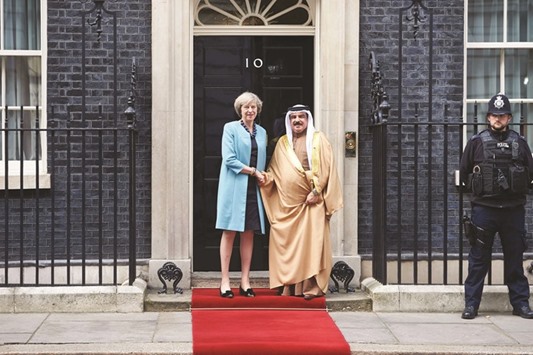 Prime Minister Theresa May greets Bahrain king Hamad bin Isa al-Khalifah outside 10 Downing Street in London yesterday.