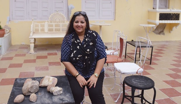 Aaliya Sultana Babi posing with fossilised dinosaur eggs at her palace in Balasinor, some 100km from Ahmedabad.