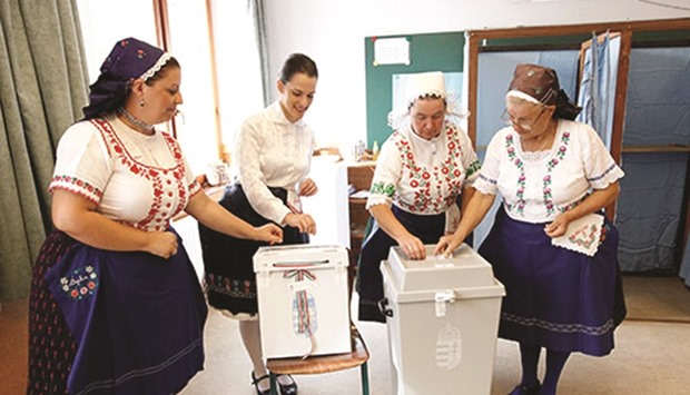 Hungarian women wearing traditional costumes attending a referendum on EU migrant quotas in Veresegyhaz, Hungary, on October 2. After the rise of fascism and during the Cold War, the worldu2019s democracies seemed to recognise that referendums and plebiscites are the handmaidens of autocrats seeking to concentrate power.