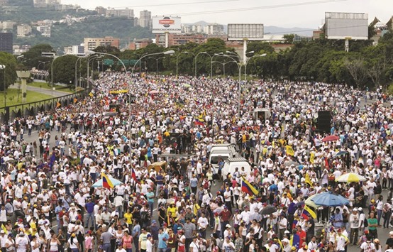 Opposition supporters take part in a rally against Venezuelau2019s President Nicolas Madurou2019s government in Caracas yesterday.