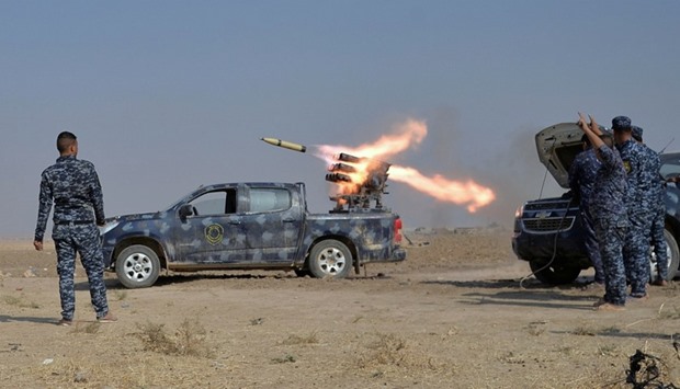 Federal police forces launch a rocket during clashes with Islamic State militants in south of Mosul.