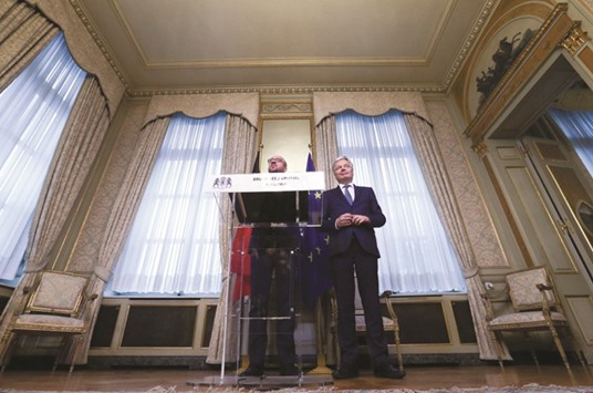 Belgiumu2019s Prime Minister Charles Michel (left) and Foreign Minister Didier Reynders make a statement at the end of a meeting on the Comprehensive Economic and Trade Agreement (CETA) at the Lambermont Residence in Brussels yesterday. u201cAn agreementu201d has been found in support of the deal, Michel told the press conference after marathon talks to win over holdouts in Belgiumu2019s French-speaking community.
