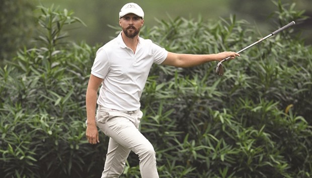Rikard Karlberg of Sweden reacts after a shot at the World Golf Championships-HSBC Champions golf tournament in Shanghai yesterday.