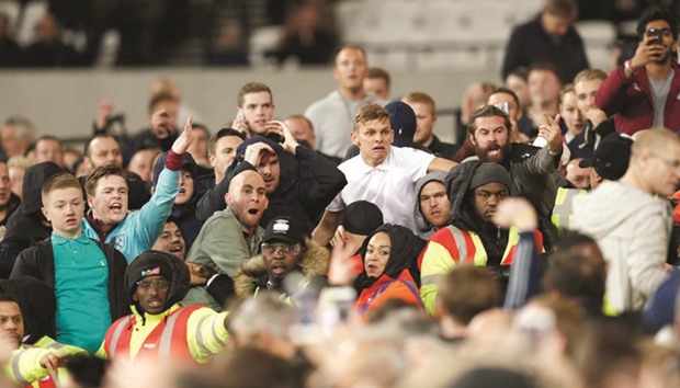 West Ham Unitedu2019s fans gesture towards Chelsea fans during League Cup match at London Stadium. (Reuters)