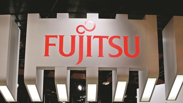 A logo of Fujitsu is seen at the Combined Exhibition of Advanced Technologies at the Makuhari Messe in Chiba, Japan. The Tokyo-based firm said it and Lenovo, the worldu2019s largest PC maker, are exploring a strategic cooperation in the realm of research, development, design and manufacturing of personal computers for the global market.