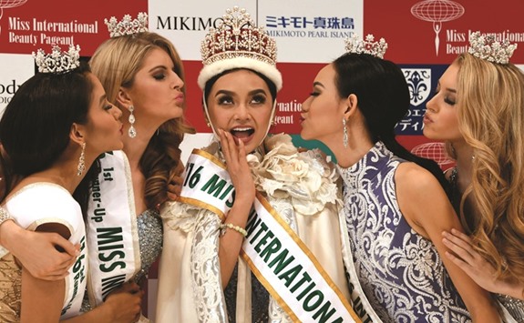 Newly elected 2016 Miss International Kylie Verzosa from Philippines with 3rd runner-up Miss Nicaragua Brianny Chamorro (L), 1st runner-up Miss Australia Alexandra Britton (2nd L), 2nd runner-up Miss Indonesia Felicia Hwang (2nd R) and 4th runner-up Miss USA Kaitryana Leinbach (R) during the Miss International beauty pageant final in Tokyo.